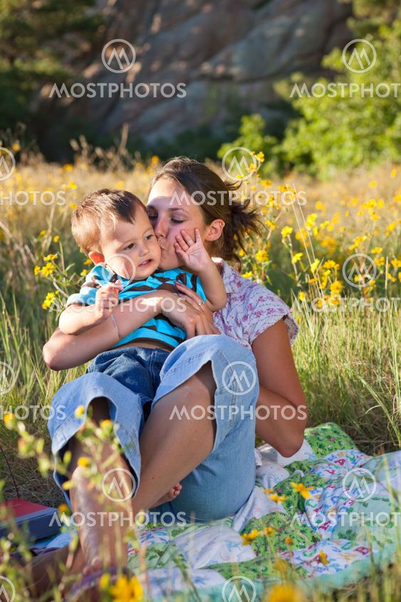 Mother kissing her son