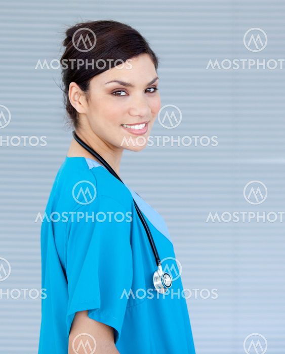 Beautiful female doctor looking at the camera