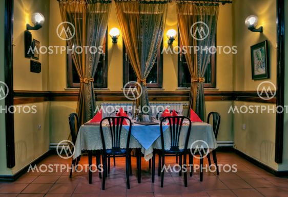 Restaurant dinner on table with chairs and lamp