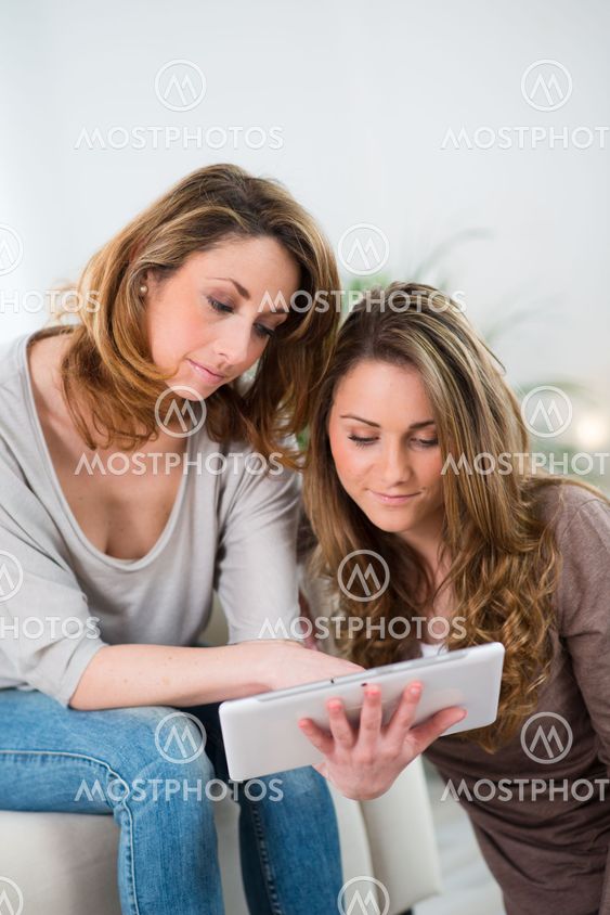 portrait of two beautiful girls at home