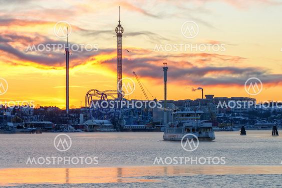 Ferry departs in the cold winter morning with Grona Lund...
