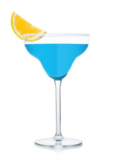 Blue lagoon summer cocktail in margarita glass with...