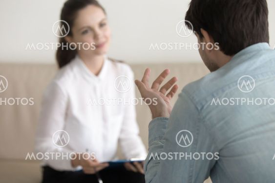 Female psychologist consulting male patient, job interview, busi