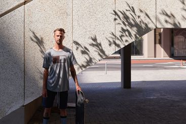 Skateboard, portrait and hobby with man in city for...