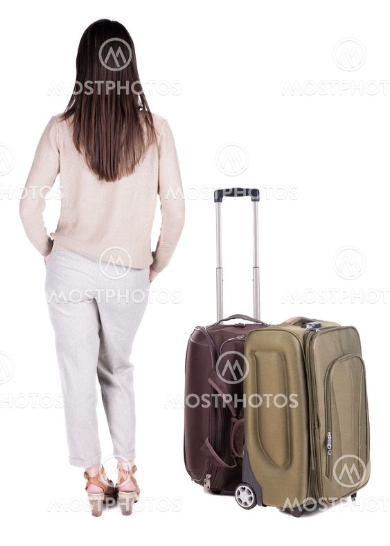 back view of standing young beautiful brunette woman.