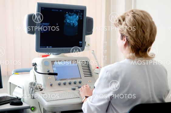 medical doctor during ultrasound investigation