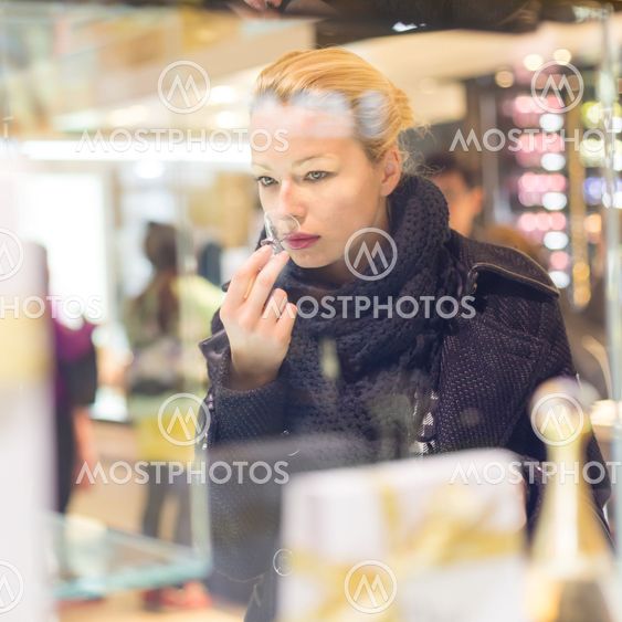Beautiful woman shopping in beauty store.