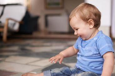 Growth, development and childhood for toddler in lounge...