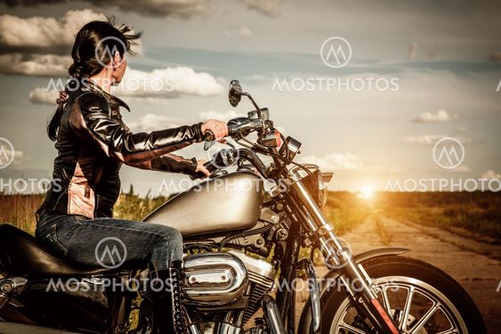 Biker girl on a motorcycle by Andrey Armyagov Mostphotos