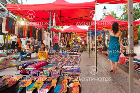 Luang Prabang, Laos - May 2012: Luang Prabang Night Market, popular tourist venue for souvenirs and handicraft products located on main street in central area in front of the Royal Palace Museum in the UNESCO World Heritage town of Lao PDR.