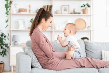 Happy loving family. Mother and her toddler baby boy...