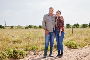 Family, portrait and woman with senior dad, farm and hug...