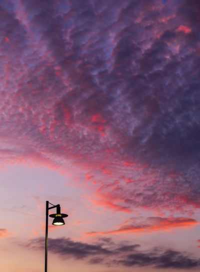 Afterglow over Gothenburg with Lamp Post and Red Sky at...