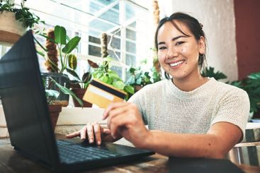 Business, laptop and portrait of woman with credit card...