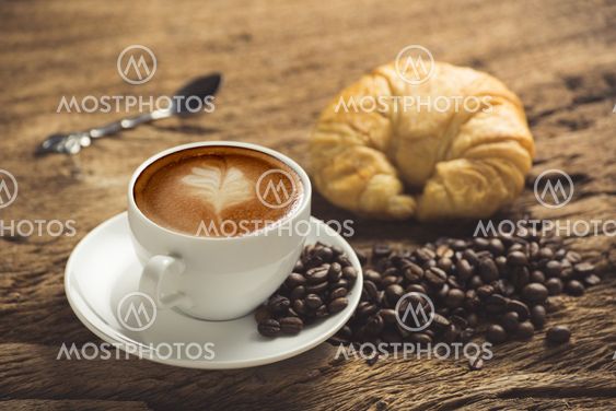 white coffee cup on wooden table