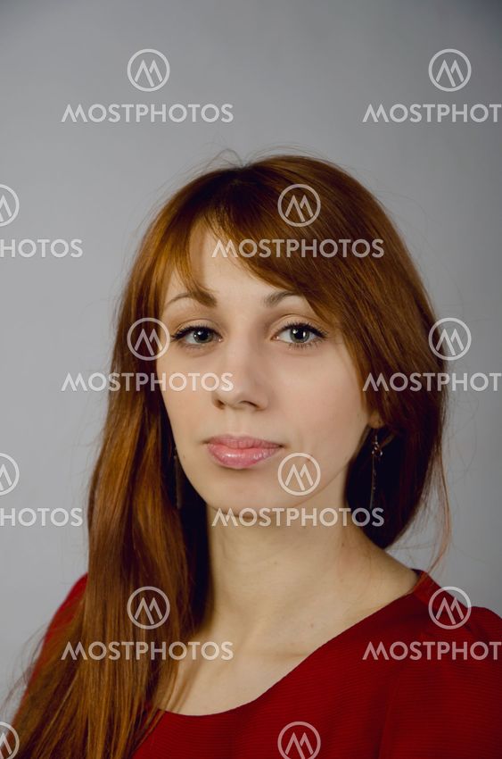 Beautiful young girl in a red dress