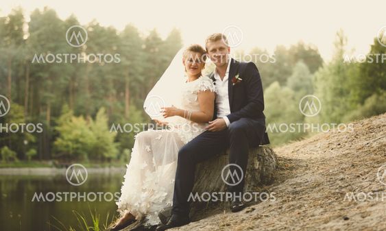 Toned photo of just married couple relaxing on the...