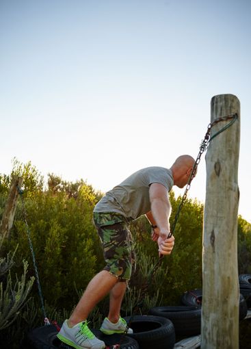 Military, man and walk on obstacle outdoor for strength...