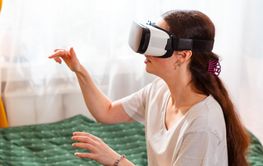 Portrait of female in cozy home environment using VR...