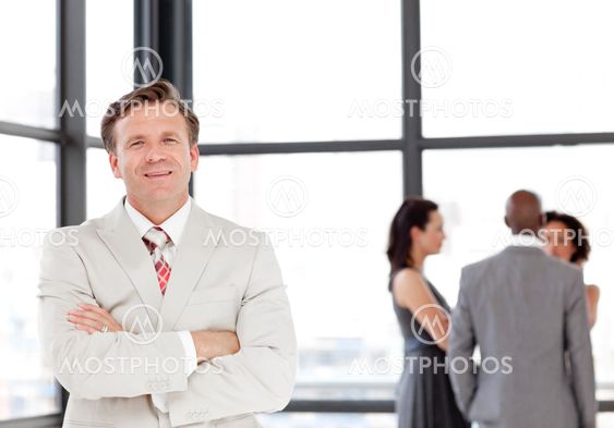 Serious male manager leading his team