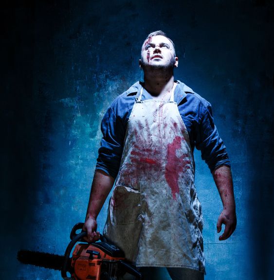 Bloody Halloween theme: crazy killer as butcher with...