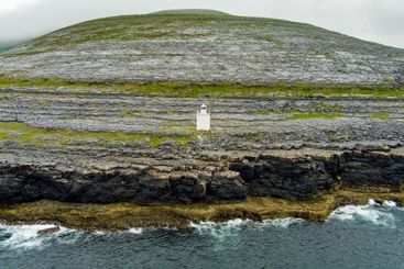 Black Head Lighthouse, situated in the rough rocky...