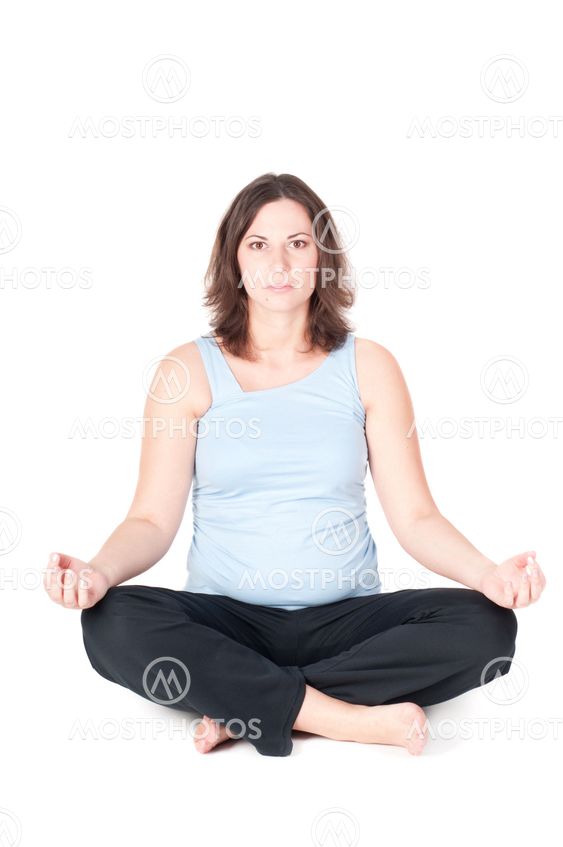 Portrait of pretty pregnant woman practicing yoga