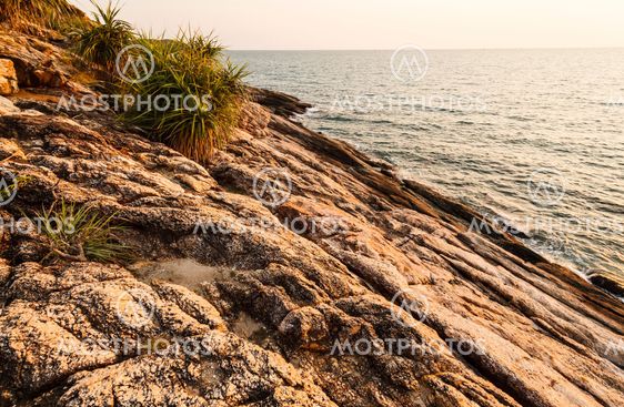 Before beatiful sunrise on the rocks, Rayong, Thailand.
