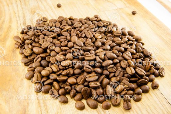 Coffee beans on vintage wooden board