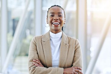 Professional portrait, arms crossed and happy black...