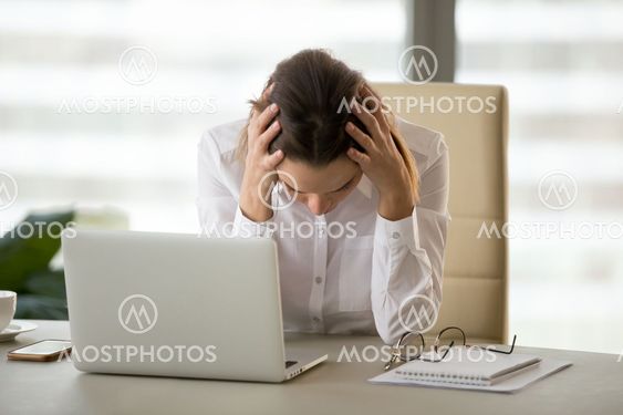 Frustrated stressed businesswoman shocked by bankruptcy or busin
