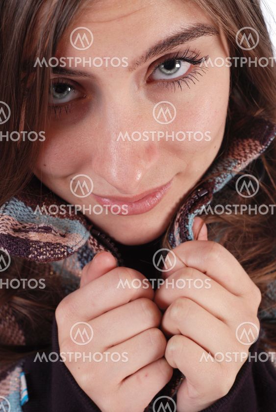Girl pulling her jacket closed