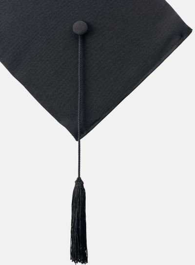 Black academic cap with long tassel isolated on white