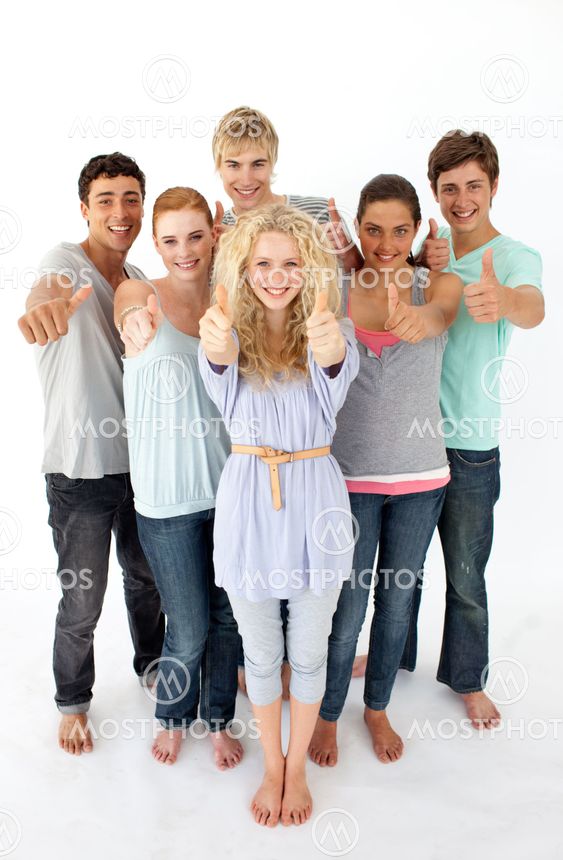 Group of teenagers standing in front of the camera with thumbs up