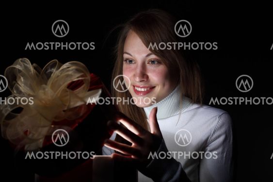 Young woman reading a magic book