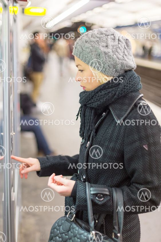 Lady buying ticket for public transport.