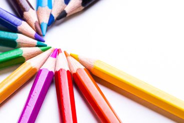 Vibrant colored pencils arranged in a circular pattern...