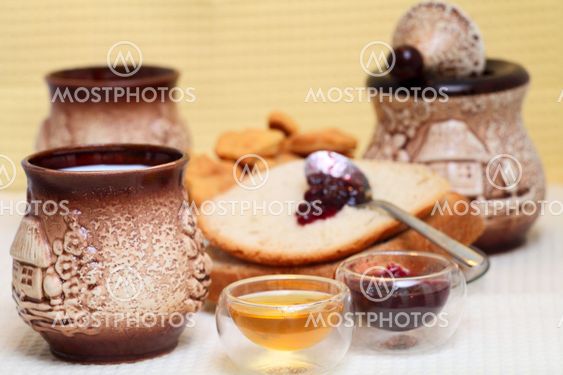 Homemade bread with redberries jam and honey