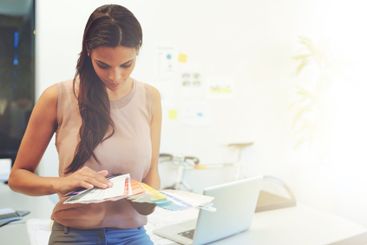 Woman, color swatch and choice in office for business,...