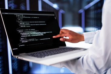 Cloud Computer Engineer Coding In Server Room In Data...