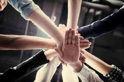 multiethnic Group of young business people celebrating...