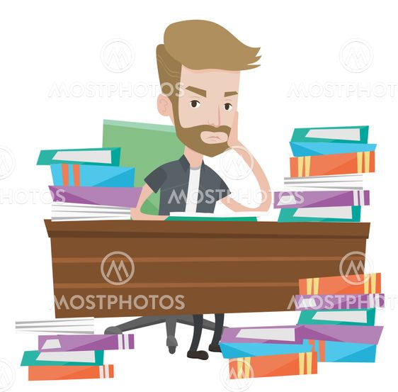 Student sitting at the table with piles of books.