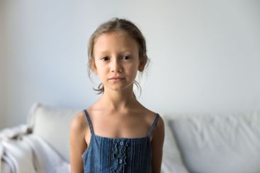 Head shot portrait of cute little girl