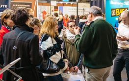 Education fair in France with people listening