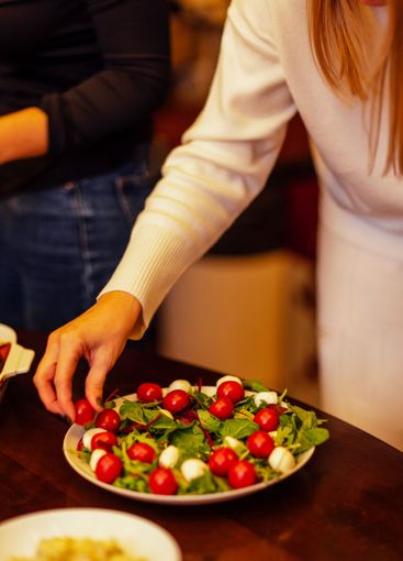 Close-up of a salad plate with mozzarella and herbs....