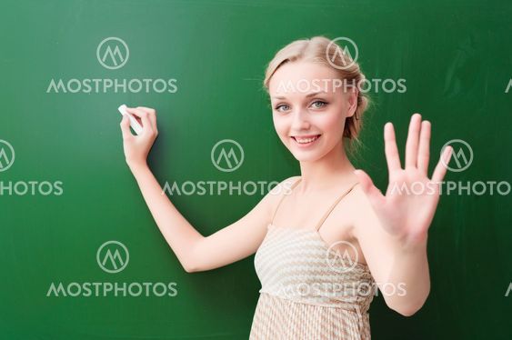 young beautiful teacher shows five points