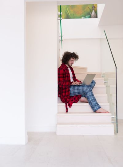 freelancer in bathrobe working from home