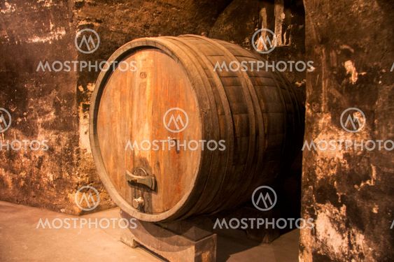 Old wooden barrel in the wine cellar of monastery