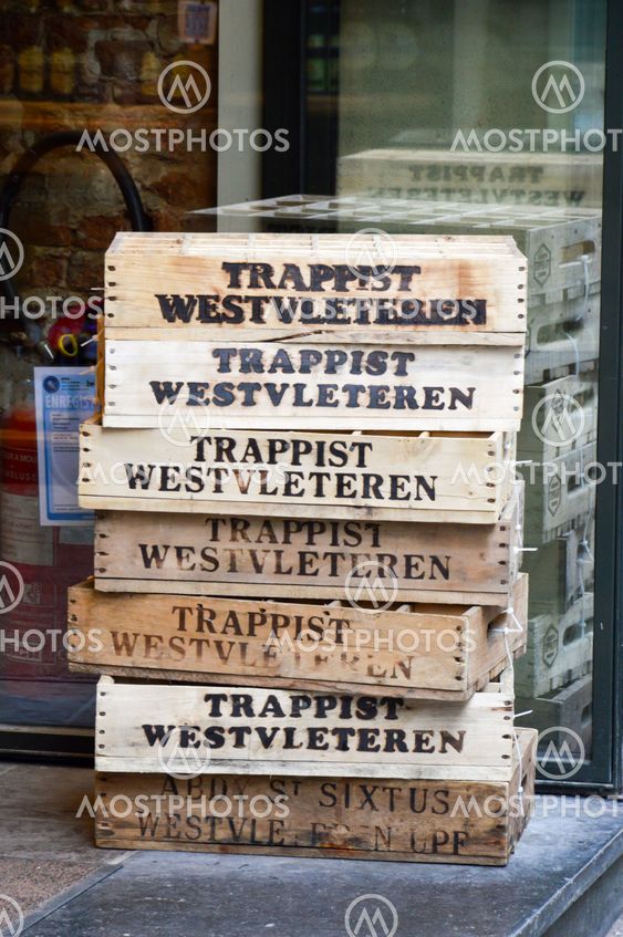 Brussels, Belgium - April 2015: Empty wooden crate of Belgian beer in front of liquor store in Brussels, Belgium