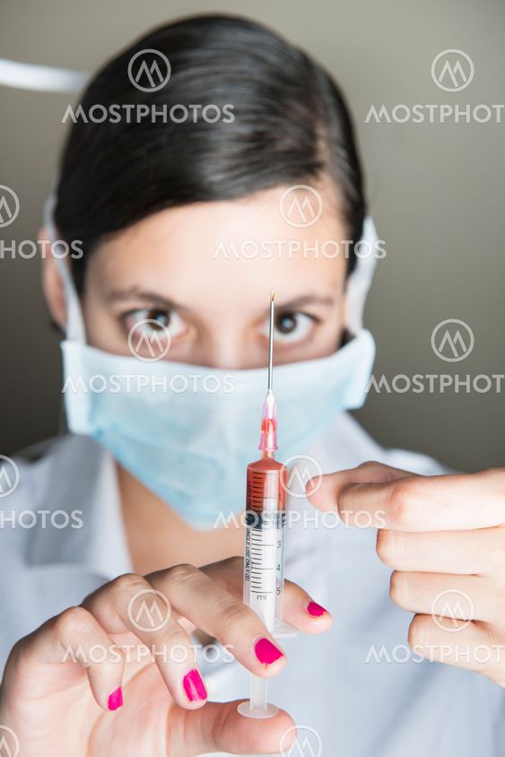 Beautiful women holding syringe
